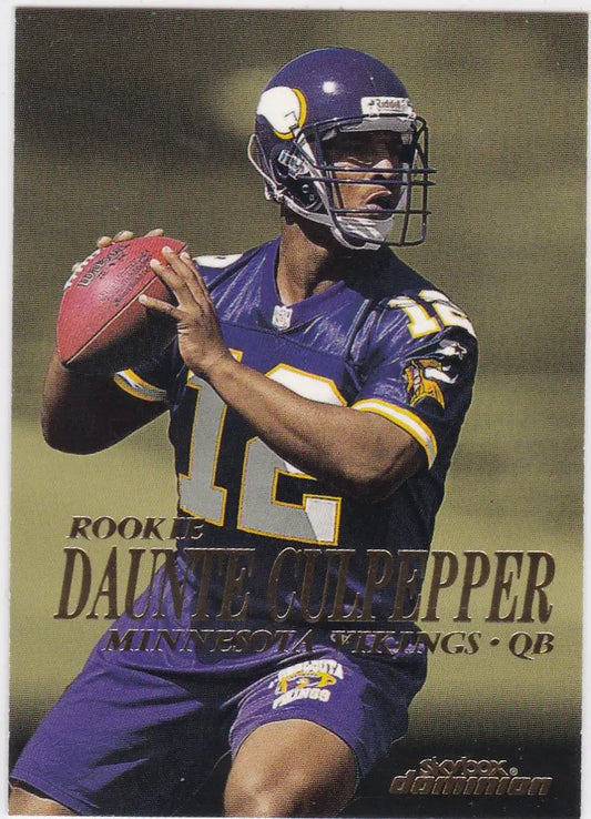 Minnesota Vikings quarterback Daunte Culpepper in purple uniform holding football