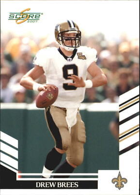 Drew Brees in a white jersey preparing to throw for New Orleans Saints Score Glossy card