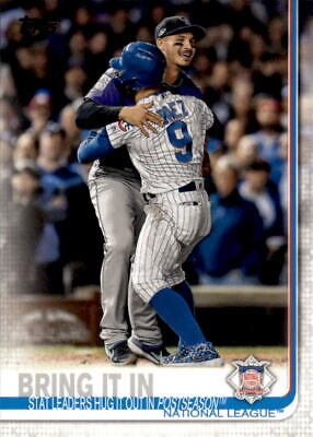 Baseball players Nolan Arenado and Javier Baez celebrate a victory in pinstriped uniforms