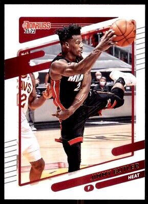 Basketball player in black Miami Heat uniform making acrobatic play for Panini Donruss