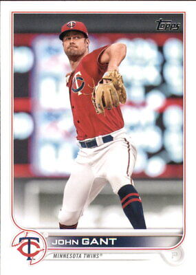 Baseball card of John Gant Minnesota Twins pitcher in red jersey mid-throw