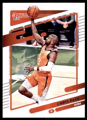 Basketball player in orange Phoenix Suns uniform shooting for hoop, Panini Donruss Chris Paul