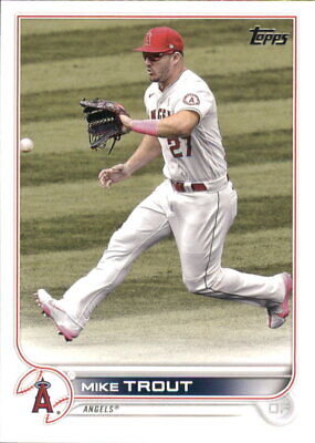 Mike Trout in white Los Angeles Angels uniform making a fielding motion