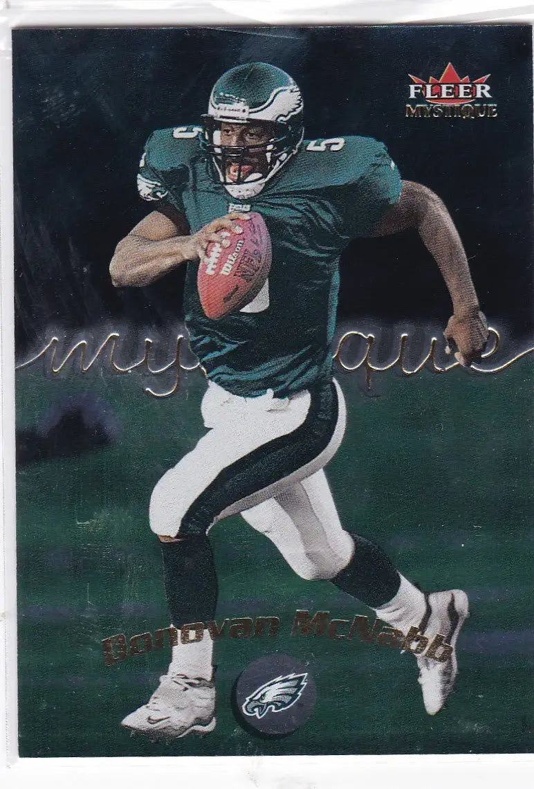 Donovan McNabb running with the ball in his Philadelphia Eagles green jersey