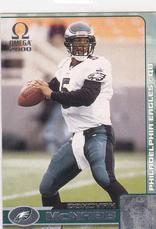 Philadelphia Eagles player Donovan McNabb in white jersey throwing pass, Pacific Omega