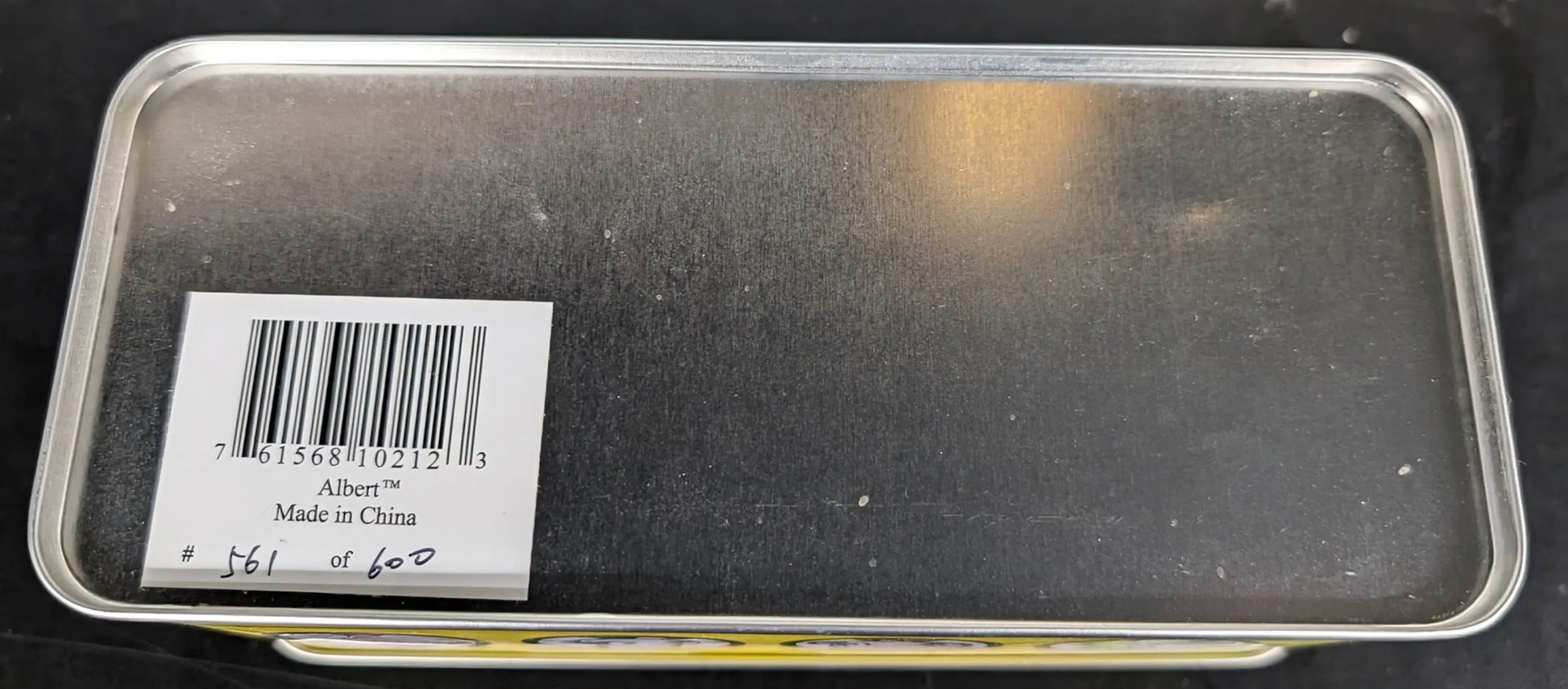 Rectangular metal serving tray with barcode sticker for vintage-style tin box product