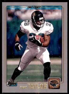 Jacksonville Jaguars Fred Taylor wearing white jersey 28 carrying football, text-align center