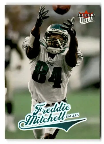 Football player Freddie Mitchell catching a pass in original gloss Fleer Ultra card