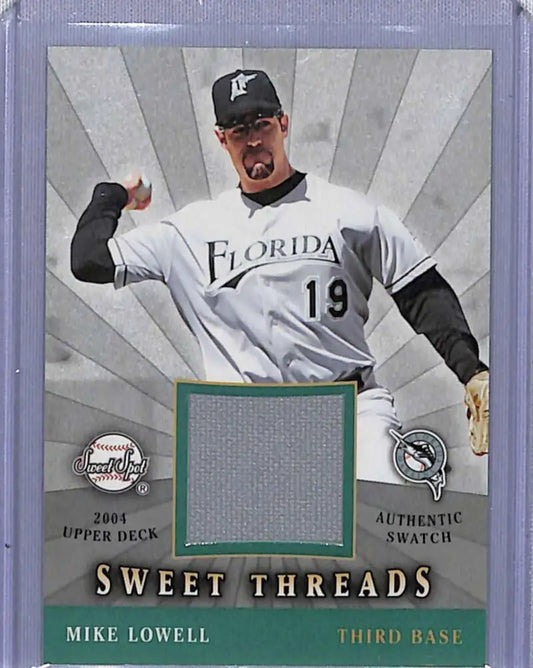 Baseball card of Mike Lowell with Florida Marlins jersey swatch #19 from 2004 Upper Deck