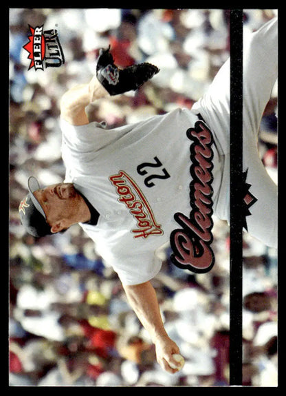 Baseball player in white Montreal Expos uniform pitching in Roger Clemens Houston Astros card