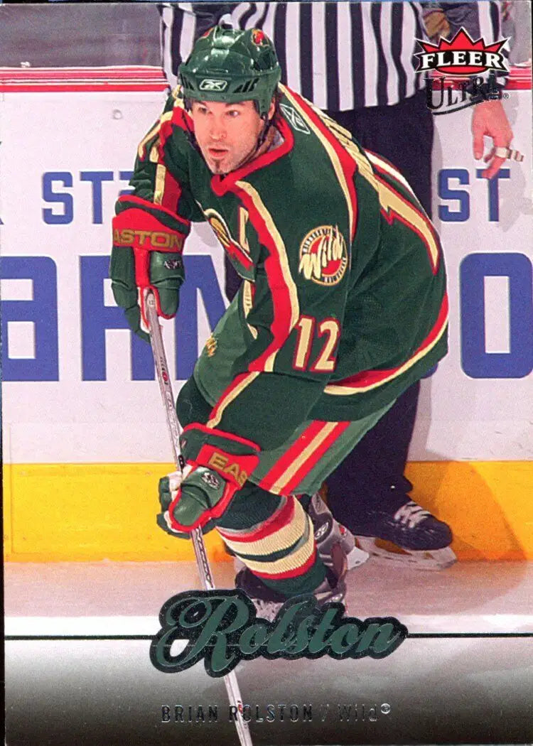 Hockey player in Minnesota Wild jersey displaying Fleer Ultra Brian Rolston card #102