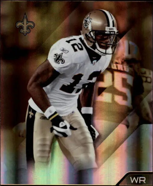 Football player in Saints uniform showcasing Marques Colston Absolute Memorabilia card