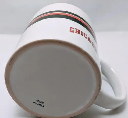 White mug with black and red stripes featuring Chicago Bulls NBA logo design