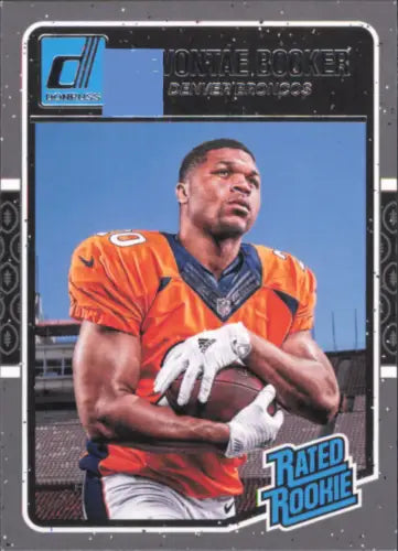 Devontae Booker Rookie card featuring Denver Broncos player in orange jersey holding football