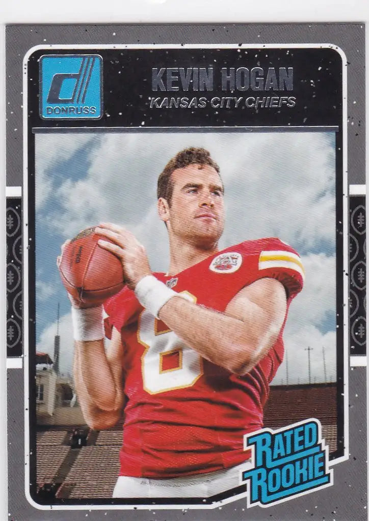 Football player in red jersey holding football for Kevin Hogan Rated Rookie card