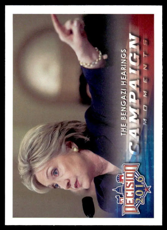 Trading card of performer with raised arm against red and blue, Bengazi Hearings theme