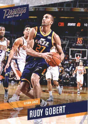 Rudy Gobert holding basketball, showcasing Utah Jazz talent in 2017-18 Prestige card