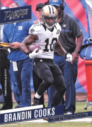 Football player Brandin Cooks running with ball for New England Patriots NFL card