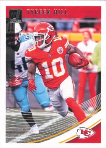 Tyreek Hill Kansas City Chiefs football card in red and white uniform carrying ball