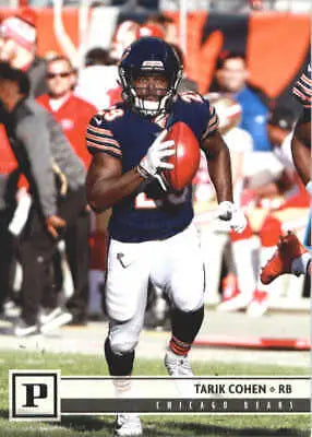 Football player holding a football from the Tarik Cohen Chicago Bears NFL card