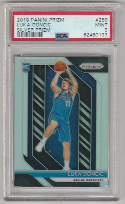 Graded Luka Doncic Silver Prizm basketball card in blue uniform shooting ball