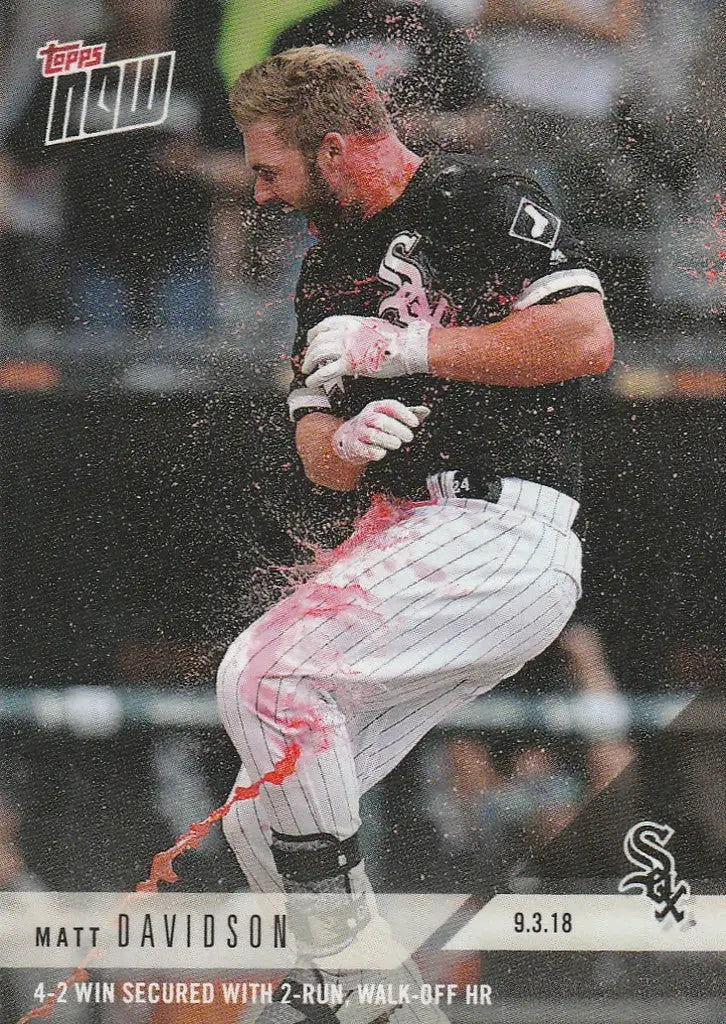 Matt Davidson swinging bat in white and black uniform, water spray during 4-2 win