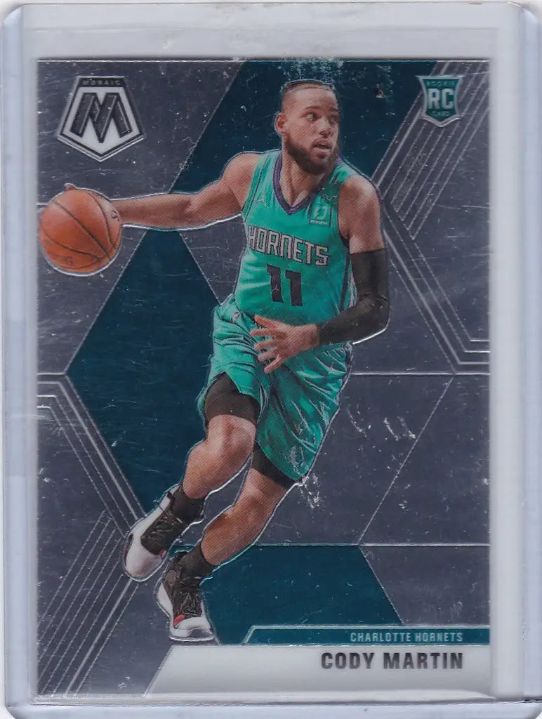 Basketball trading card of Cody Martin in teal Charlotte Hornets uniform dribbling ball