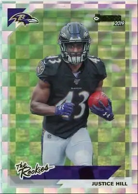 Justice Hill in black uniform carrying football for Baltimore Ravens 2019 Donruss insert