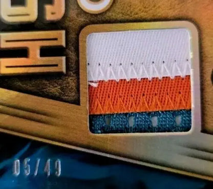 Three-colored patch of fabric from 2019 Panini Gold Zach Thomas Short Print card