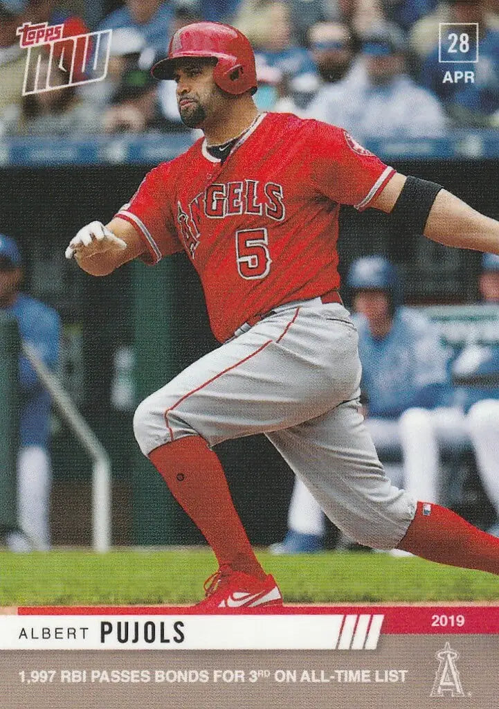 Baseball player in red Angels uniform swinging bat for Albert Pujols RBI 3rd all-time