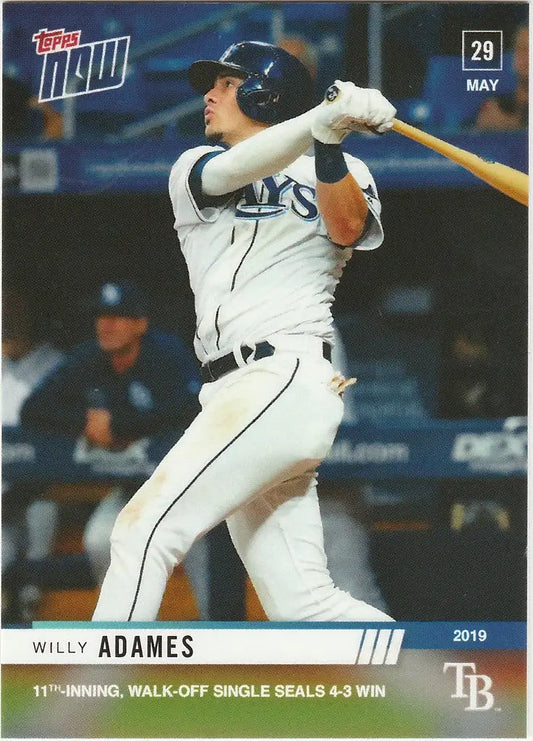 Willy Adames in a white Tampa Bay Rays uniform swinging a bat