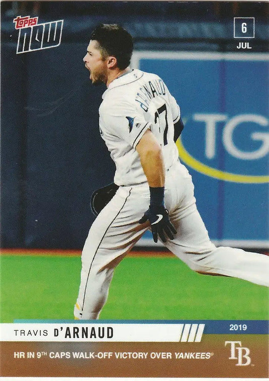 Baseball player in white uniform running for home run Tampa Bay Rays on field