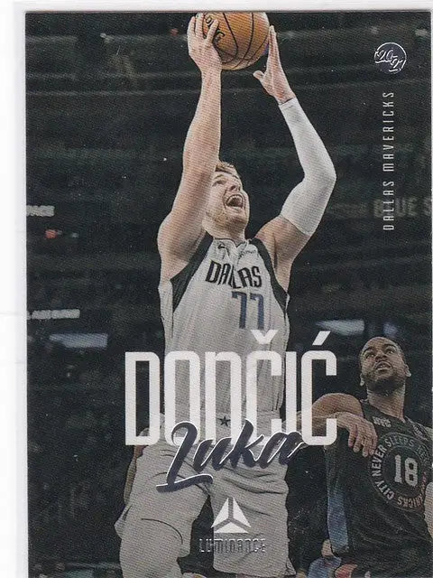 Basketball trading card of Luka Doncic shooting in his Dallas Mavericks white jersey