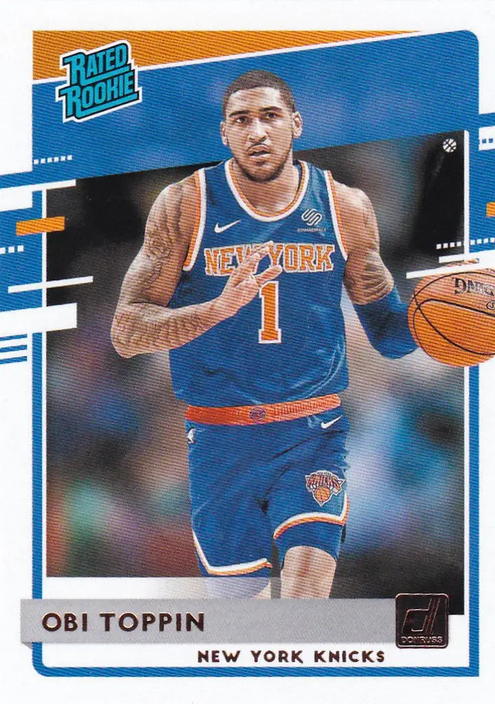 Basketball trading card of Obi Toppin, New York Knicks Rated Rookie dribbling a ball