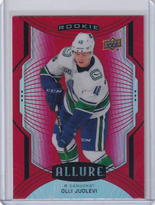 Hockey trading card of Olli Juolevi from the Vancouver Canucks in a white jersey