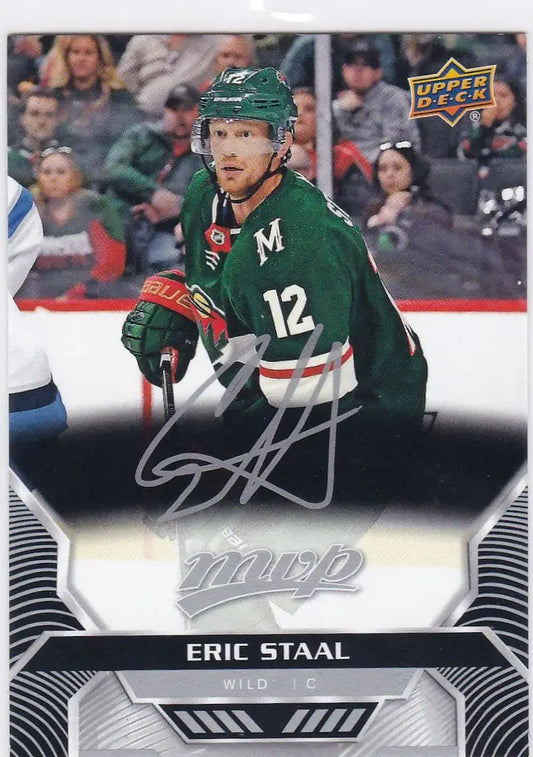 Hockey player in green jersey 12 holding stick from Eric Staal Silver Script Wild