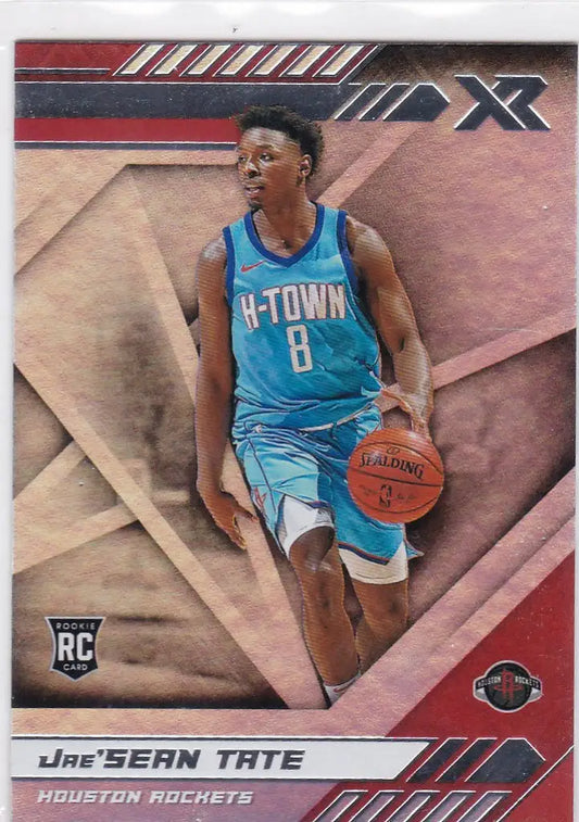 Basketball player in light blue Houston Rockets jersey, dribbling ball for Tate RC Houston