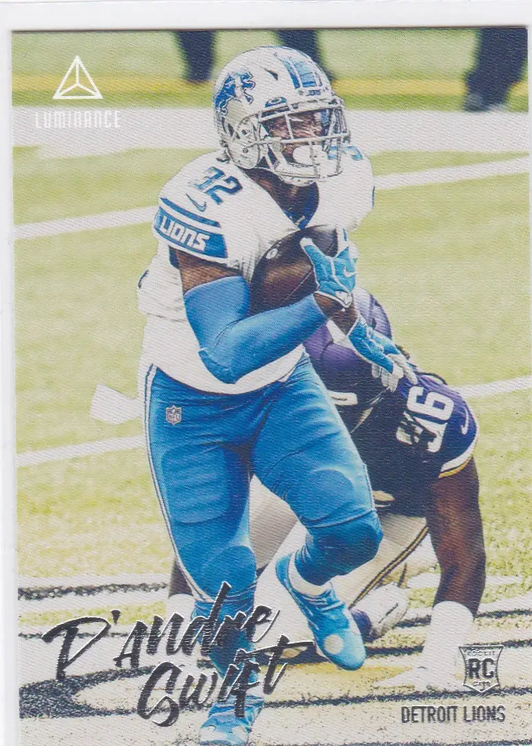 Football player in light blue Detroit Lions uniform running with football for Panini Chronicles Luminance