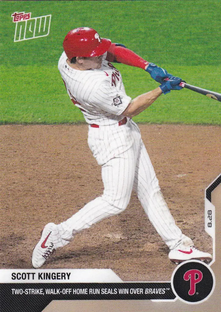 Baseball player in white uniform with red helmet hitting bat, Scott Kingery Philadelphia Phillies