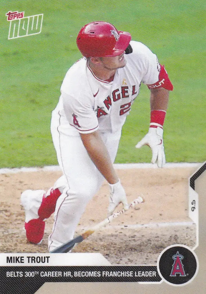 Baseball player in white Los Angeles Angels uniform swinging bat, Mike Trout Los Angeles