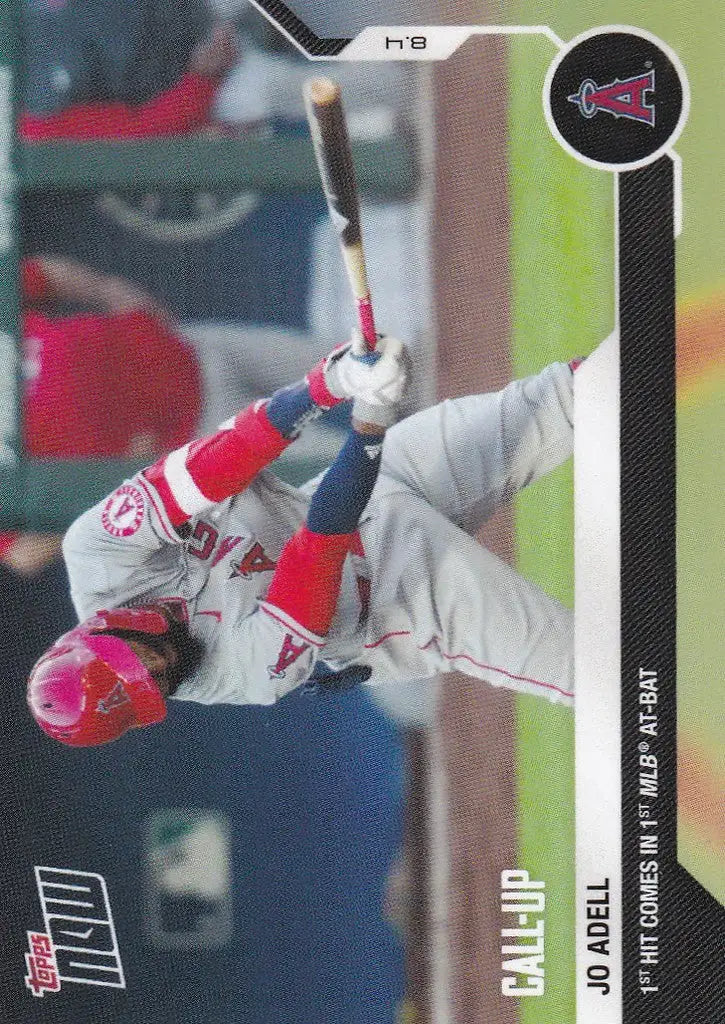 Baseball player Jo Adell in a white and red uniform swinging a bat for Los Angeles Angels