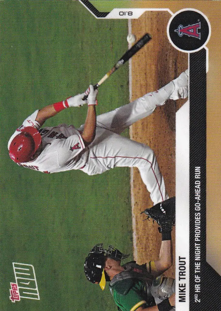 Baseball player Mike Trout swinging bat at home plate for Los Angeles Angels game