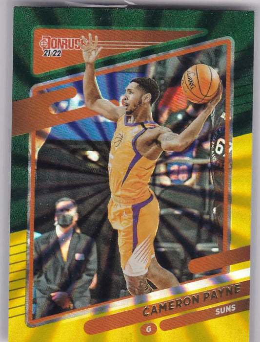 Basketball trading card of Cameron Payne Phoenix in mid-jump for Donruss Yellow Laser