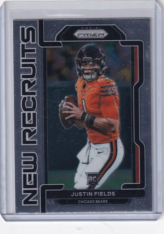 Football trading card of NR4 Justin Fields in an orange Chicago Bears jersey holding a football