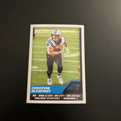 Christian McCaffrey on a 2021 Panini Stickers NFL Football Card featuring Sam Darnold