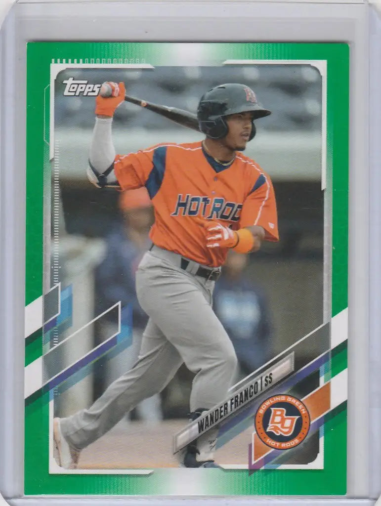 Baseball card of PD1 Wander Franco in orange jersey swinging bat for Pro Debut Green