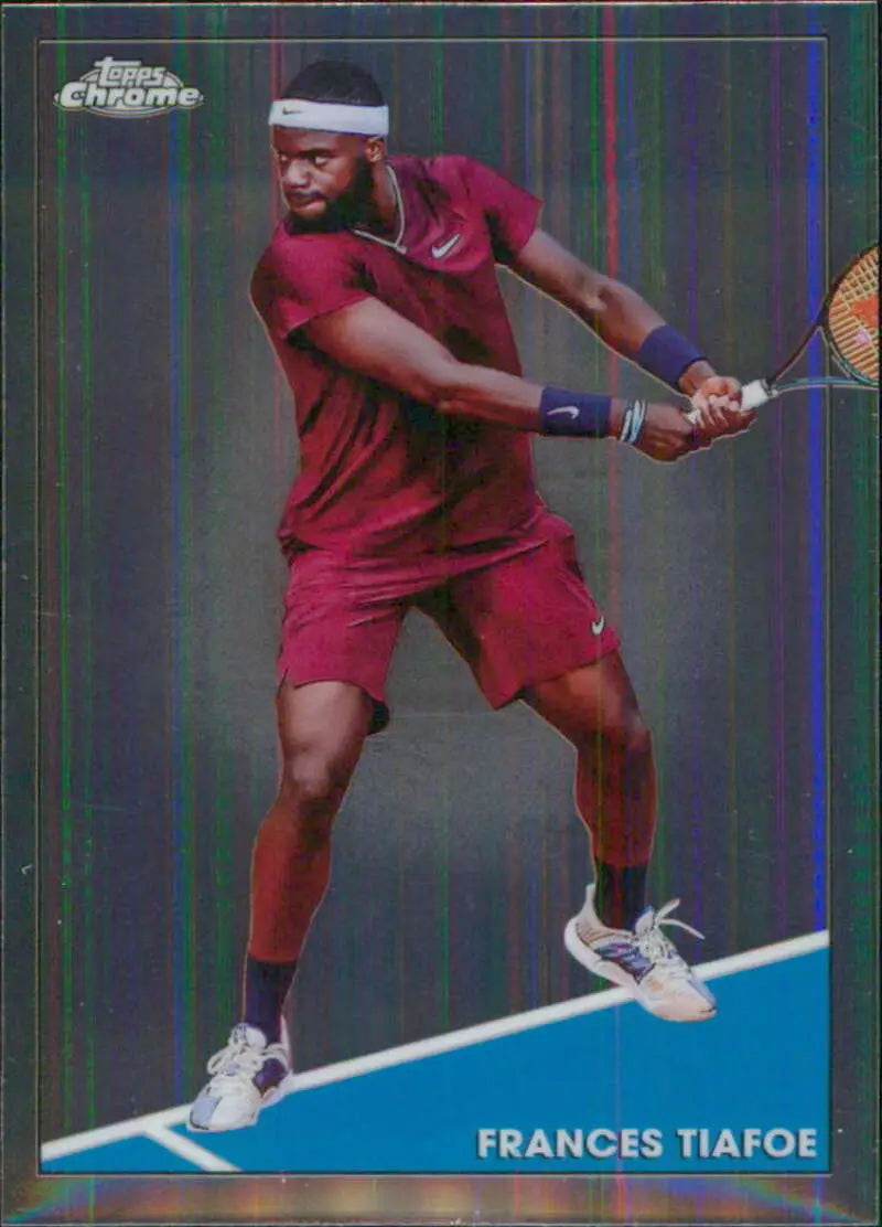 Frances Tiafoe in red attire hitting a backhand shot on Topps Chrome tennis card