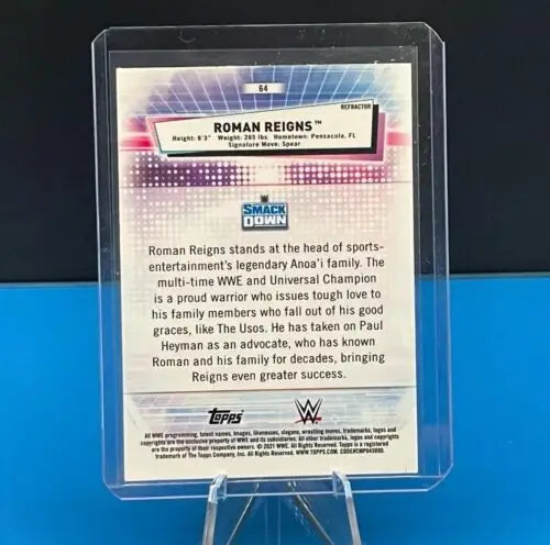 WWE trading card of Roman Reigns in a Topps Chrome protective case