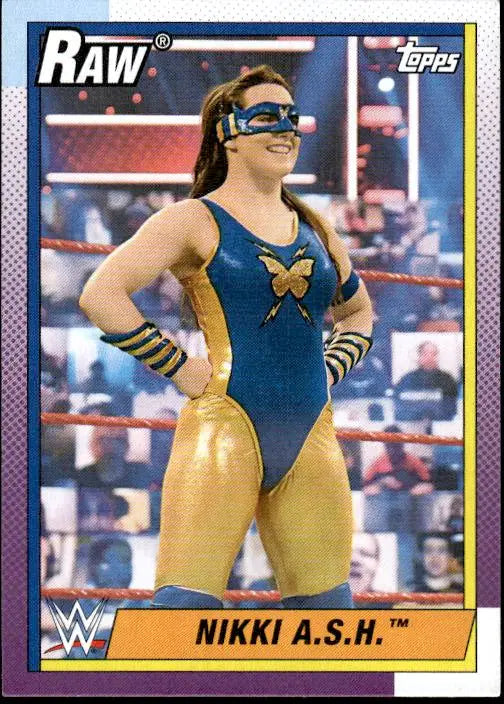 WWE trading card of Nikki A.S.H. in blue and gold superhero costume, Topps Heritage WWE