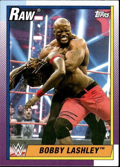 Muscular Bobby Lashley in red trunks poses during a WWE match on Topps Heritage WWE card